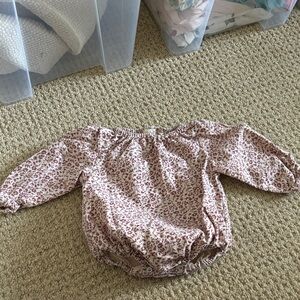 Tullabe long sleeve onesie.